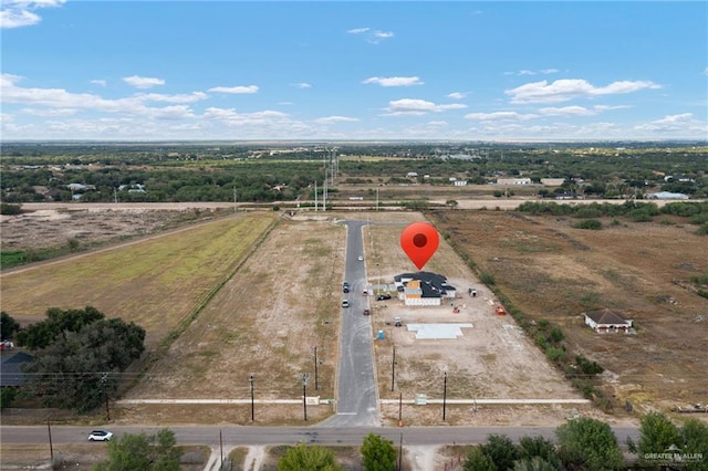 birds eye view of property with a rural view