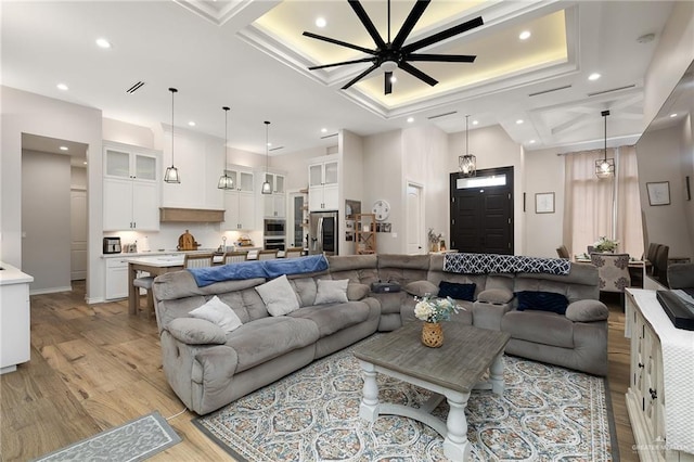 13811 N 33rd Ln, Mcallen, TX 78504 - living room featuring recessed lighting, coffered ceiling, light wood finished floors, and ceiling fan