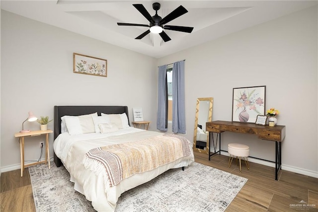 13811 N 33rd Ln, Mcallen, TX 78504 - bedroom featuring wood finished floors, ceiling fan, and a tray ceiling