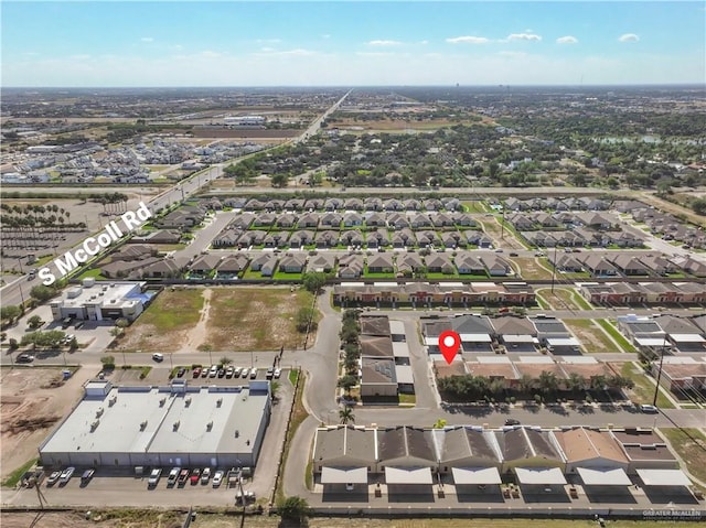 birds eye view of property with a residential view