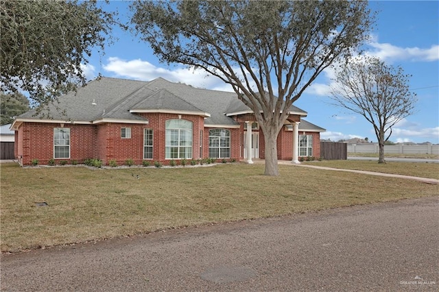 ranch-style house featuring a front lawn