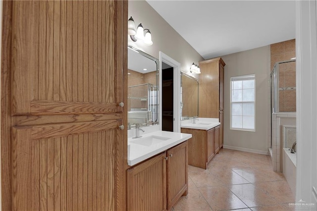 bathroom with tile patterned flooring, vanity, and plus walk in shower