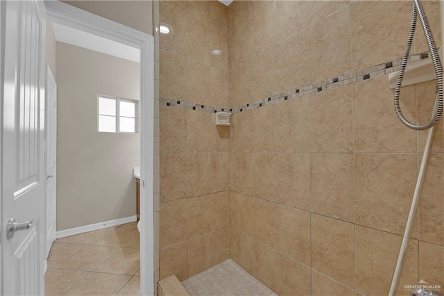 bathroom featuring a tile shower and tile patterned floors