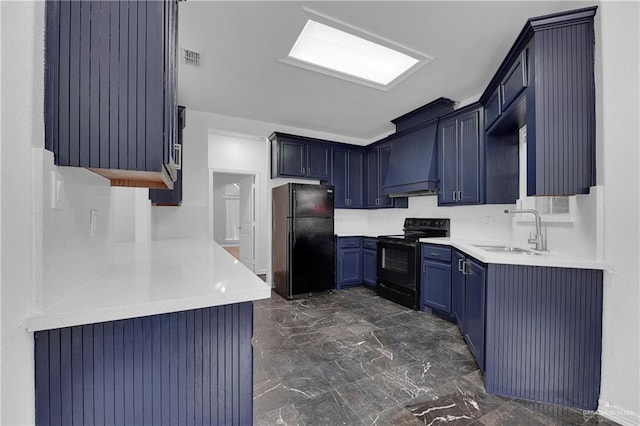 kitchen featuring custom exhaust hood, sink, blue cabinets, and black appliances