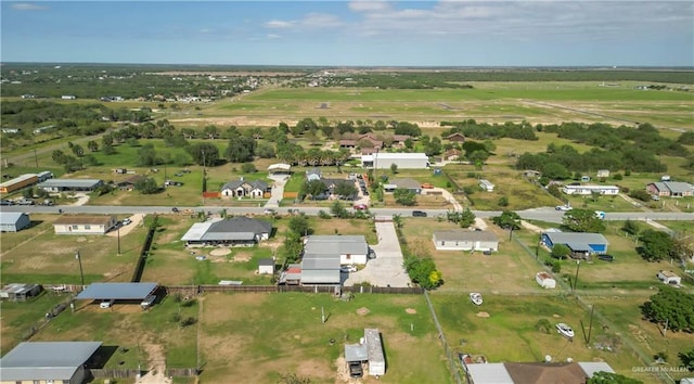 birds eye view of property with a rural view