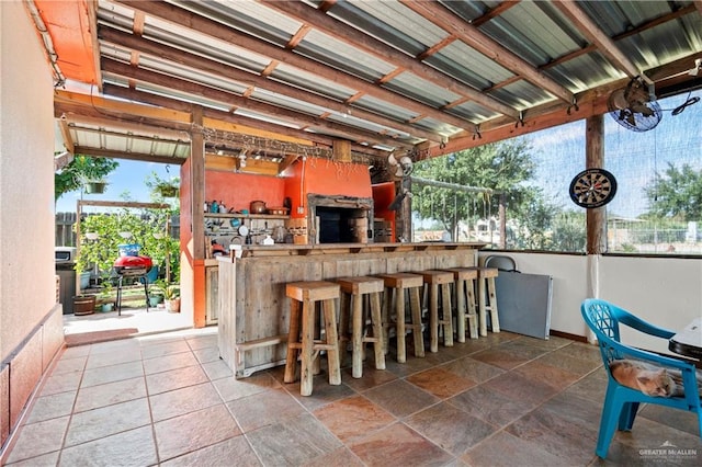 view of patio with an outdoor bar