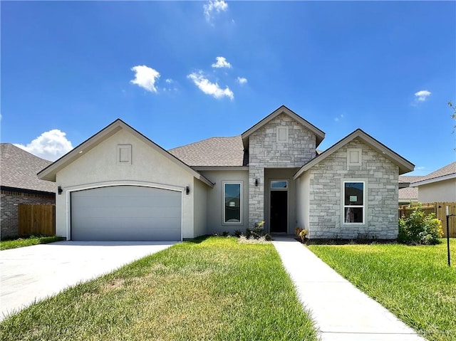 view of front of home featuring a front lawn and a garage