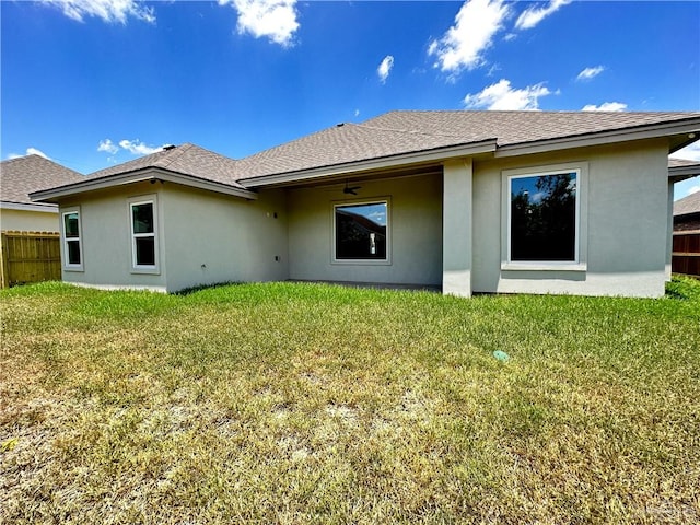 rear view of house with a lawn