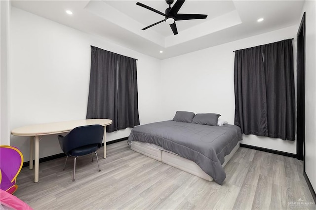 1820 Hill Dr, Mission, TX 78572 - bedroom with a raised ceiling, wood finished floors, recessed lighting, baseboards, and ceiling fan