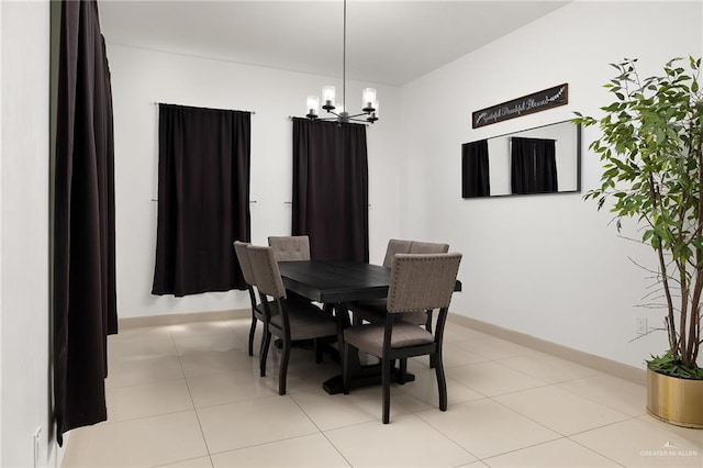 1820 Hill Dr, Mission, TX 78572 - dining room with a chandelier and baseboards