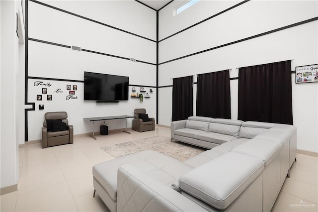 1820 Hill Dr, Mission, TX 78572 - tiled living area featuring baseboards and a towering ceiling