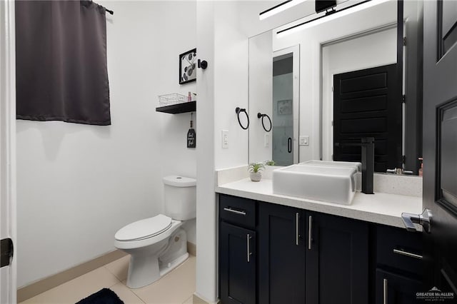 1820 Hill Dr, Mission, TX 78572 - bathroom featuring baseboards, toilet, tile patterned floors, and vanity