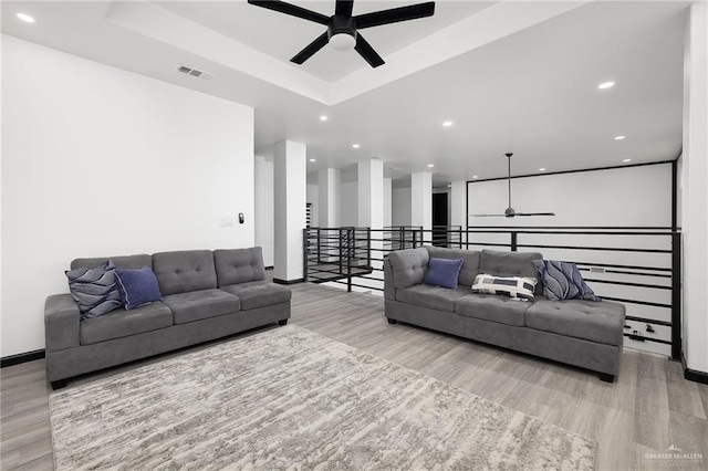1820 Hill Dr, Mission, TX 78572 - living room featuring ceiling fan, wood finished floors, recessed lighting, baseboards, and a tray ceiling