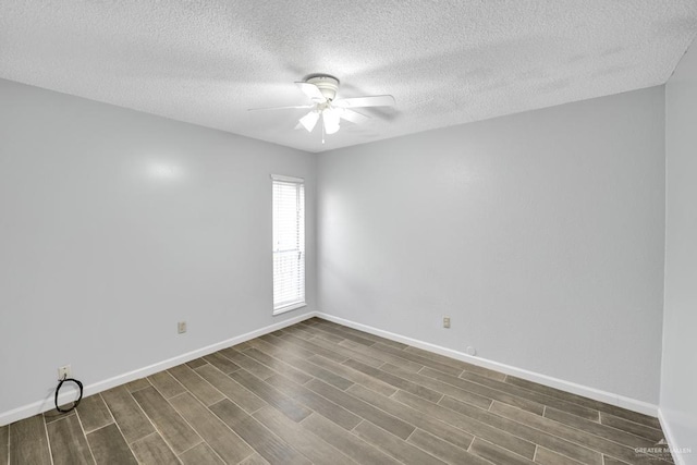 704 Kerry Ln, Mcallen, TX 78504 - spare room featuring a ceiling fan, dark wood finished floors, a textured ceiling, and baseboards