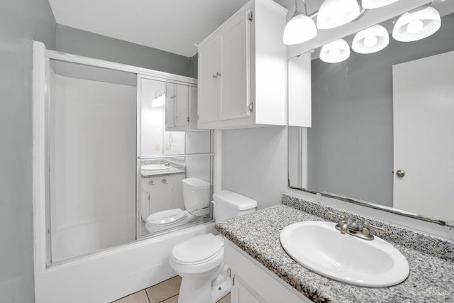 704 Kerry Ln, Mcallen, TX 78504 - bathroom with tile patterned floors, toilet, and vanity