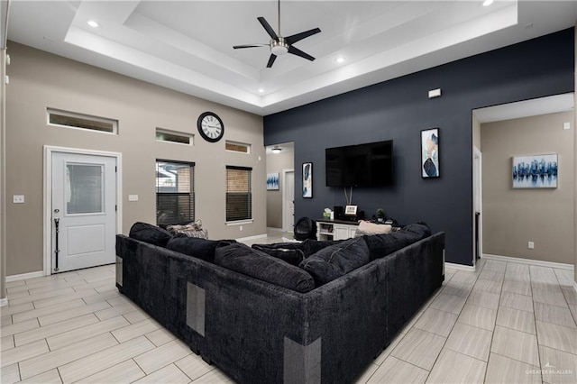 201 White Oak Dr, Los Fresnos, TX 78566 - living room featuring a tray ceiling, ceiling fan, and recessed lighting