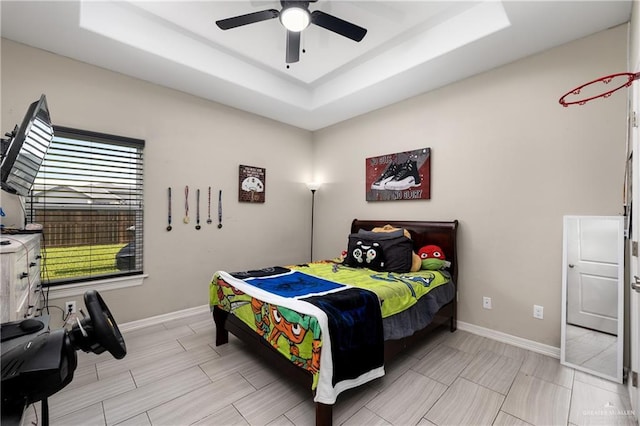 201 White Oak Dr, Los Fresnos, TX 78566 - bedroom featuring a raised ceiling and a ceiling fan