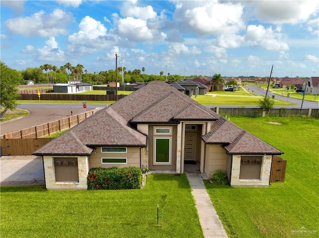 201 White Oak Dr, Los Fresnos, TX 78566 - view of front of property with roof with shingles, stone siding, and a residential view