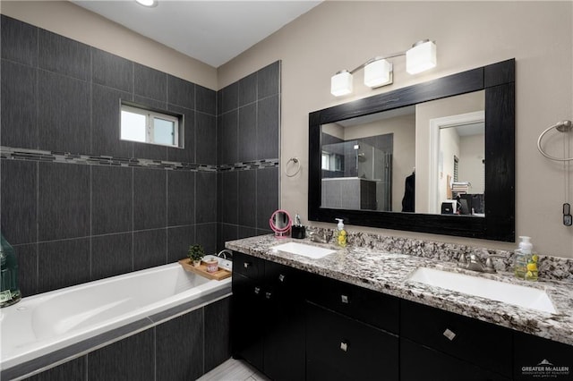 201 White Oak Dr, Los Fresnos, TX 78566 - full bath featuring a stall shower, tiled bath, and double vanity