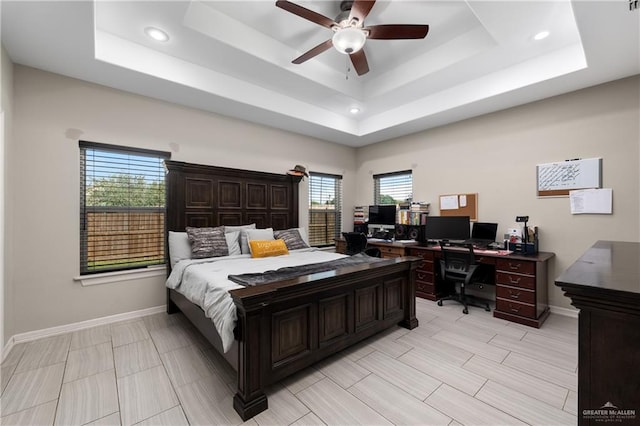 201 White Oak Dr, Los Fresnos, TX 78566 - bedroom with a tray ceiling, a desk, recessed lighting, and a ceiling fan