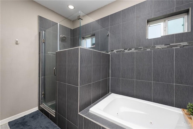201 White Oak Dr, Los Fresnos, TX 78566 - full bath with a stall shower, plenty of natural light, and a garden tub