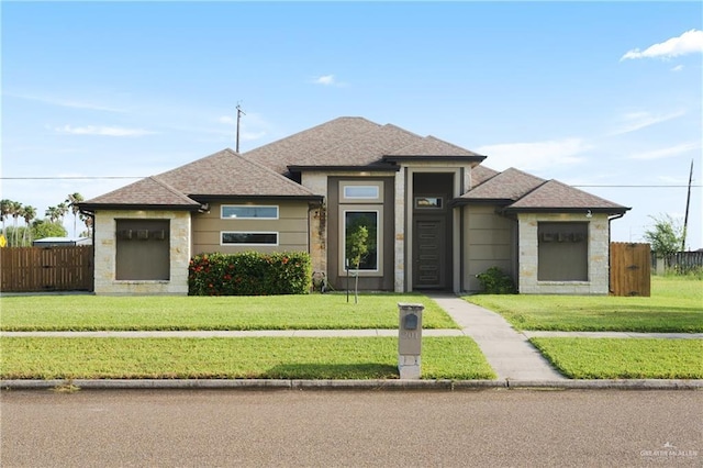 201 White Oak Dr, Los Fresnos, TX 78566 - prairie-style house with stone siding and a shingled roof