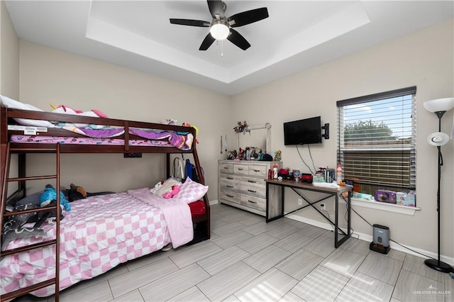 201 White Oak Dr, Los Fresnos, TX 78566 - bedroom with a tray ceiling and a ceiling fan