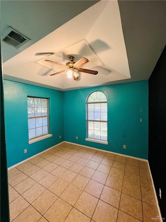 8200 Tierra Linda Ln, Mission, TX 78574 - empty room with healthy amount of natural light, light tile patterned flooring, and a ceiling fan