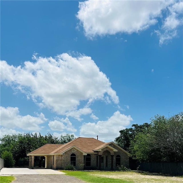 8200 Tierra Linda Ln, Mission, TX 78574 - view of front of home featuring driveway and a carport