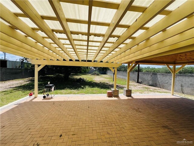 8200 Tierra Linda Ln, Mission, TX 78574 - fenced backyard with a patio area, a pergola, and area for grilling