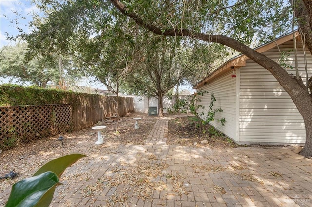 view of yard featuring a patio area and a fenced backyard