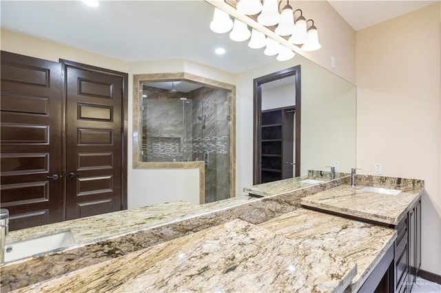 3812 Santa Fe St, Edinburg, TX 78542 - bathroom featuring a stall shower, double vanity, a spacious closet, and recessed lighting
