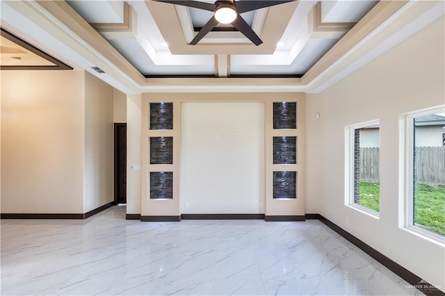 empty room featuring ceiling fan and a towering ceiling