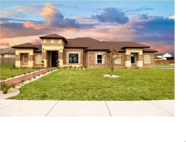 3812 Santa Fe St, Edinburg, TX 78542 - prairie-style home featuring a yard and brick siding