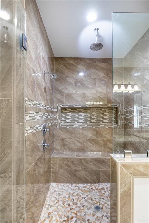 bathroom featuring a shower with shower door