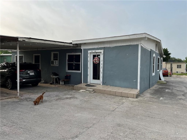 view of front of property with a carport