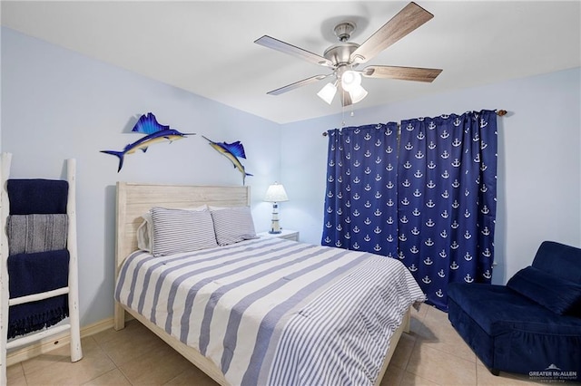 bedroom with tile patterned flooring, ceiling fan, and baseboards