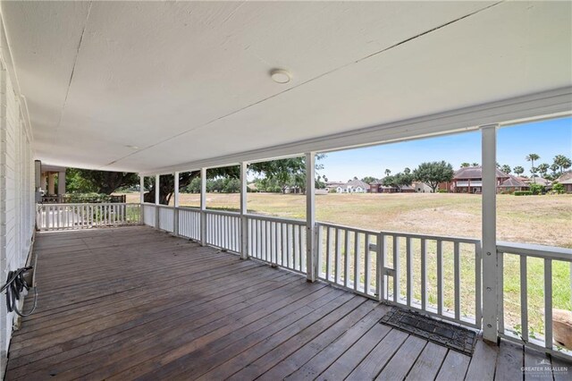 2018 Sabinal St, Mission, TX 78572 - wooden deck with a residential view and a lawn