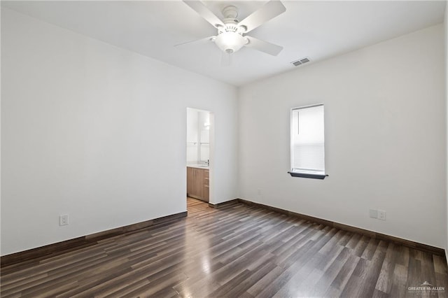 2018 Sabinal St, Mission, TX 78572 - empty room with ceiling fan, dark wood-type flooring, and baseboards