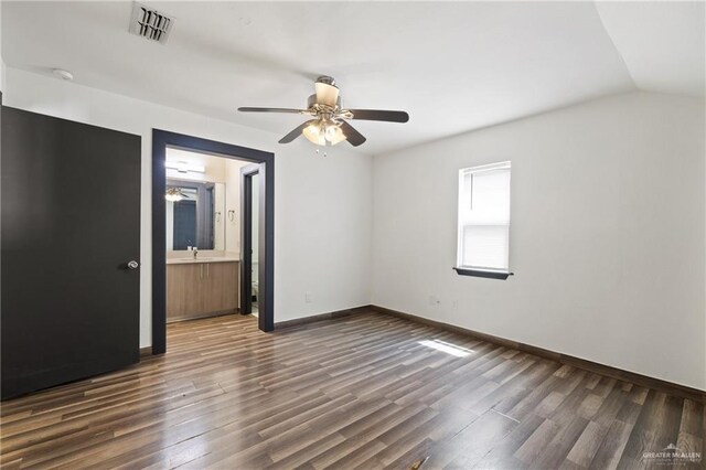 2018 Sabinal St, Mission, TX 78572 - unfurnished bedroom with wood finished floors, a sink, baseboards, and ceiling fan
