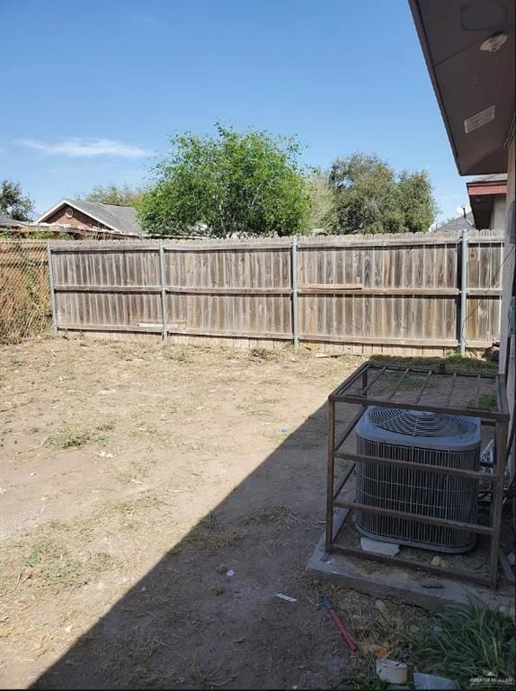 view of yard with central AC unit