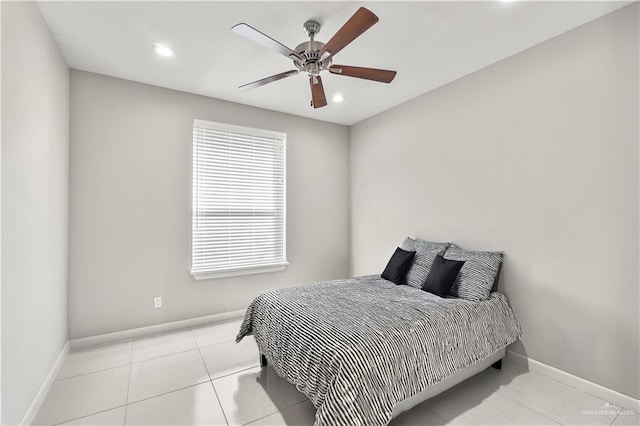 bedroom featuring ceiling fan and light tile patterned floors