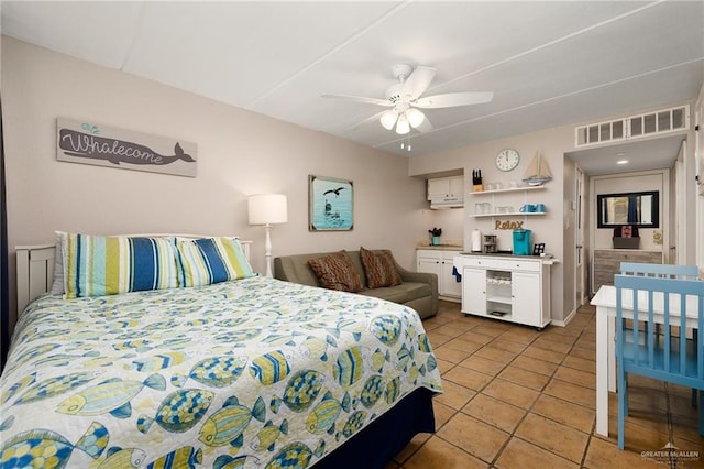 bedroom with tile patterned flooring and ceiling fan