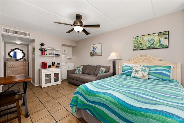 bedroom featuring ceiling fan and light tile patterned floors