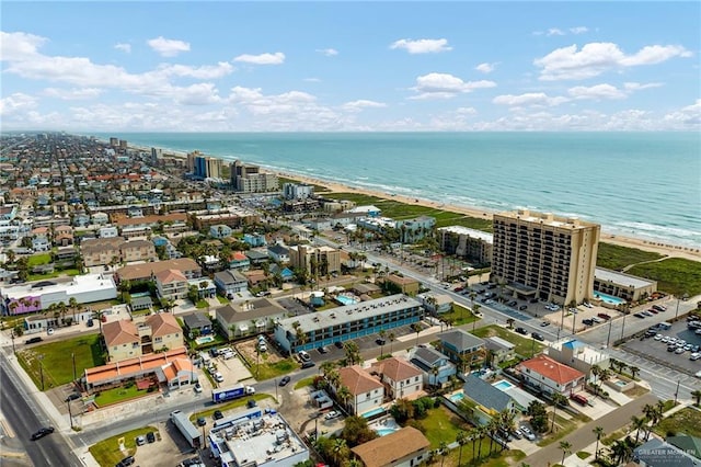 birds eye view of property with a beach view and a water view