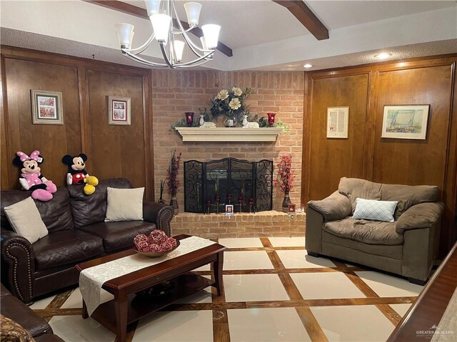 2105 Ann St Unit 0, Edinburg, TX 78539 - living room featuring a chandelier, inlaid floor details, wood walls, a fireplace, and recessed lighting