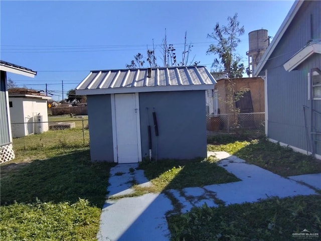 view of outbuilding with a lawn