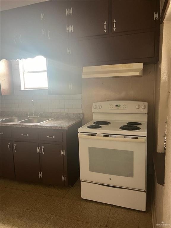 kitchen with white electric range oven, dark brown cabinets, sink, and extractor fan