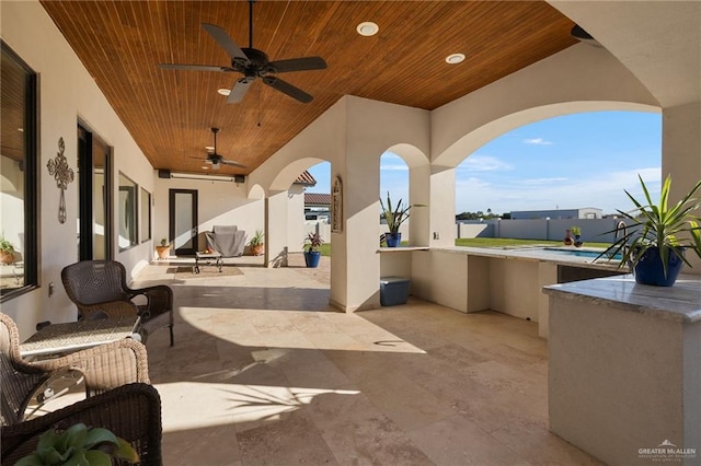 view of patio / terrace featuring ceiling fan