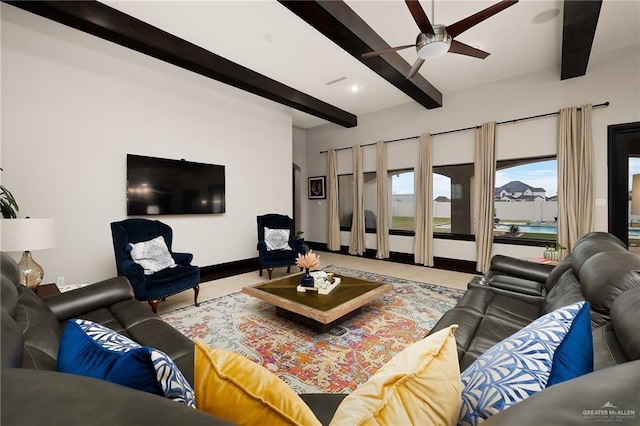 living room with beamed ceiling and ceiling fan